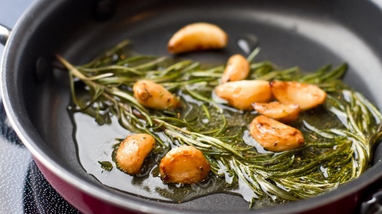 garlic and rosemary in pan