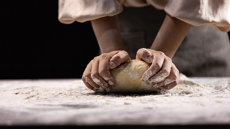 person making dough