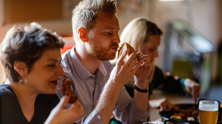 three people eating