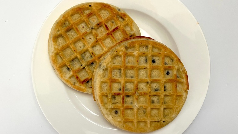 Two toasted frozen chocolate chip waffles on white plate