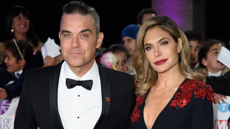 Robbie Williams and Ayda Field pose together