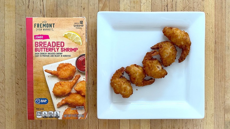Box and white plate of Fremont Fish Market Jumbo Breaded Butterfly Shrimp