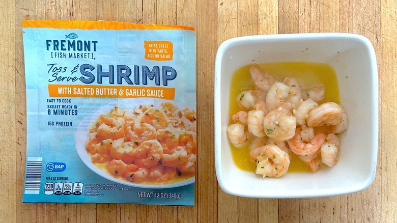 Package and white bowl of Fremont Fish Market Salted Butter & Garlic Toss & Serve Shrimp