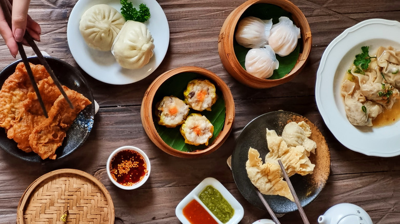Overhead view of various Chinese restaurant dishes