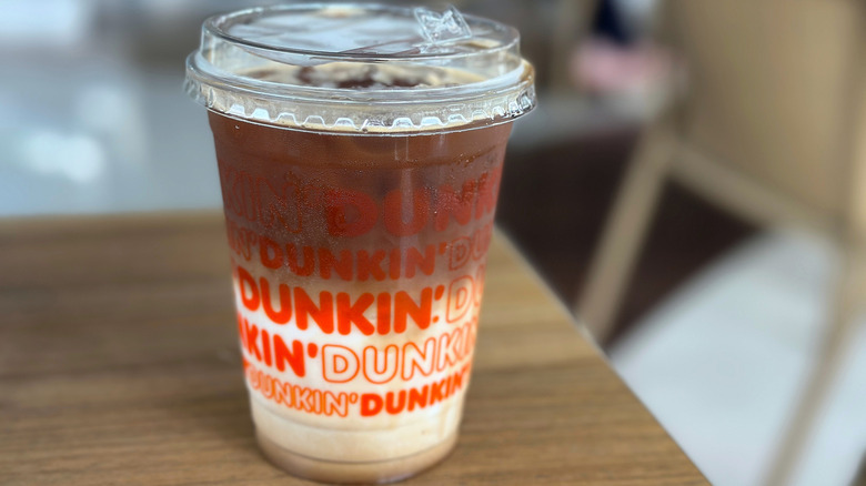 Iced latté in plastic Dunkin' cup