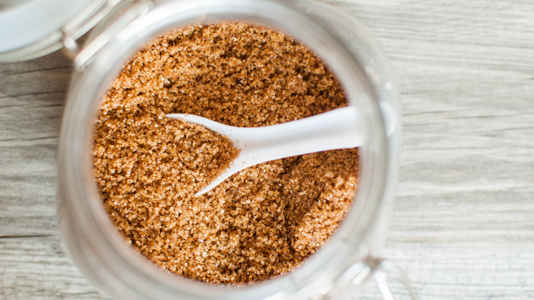 Top-down view of brown sugar in a glass jar