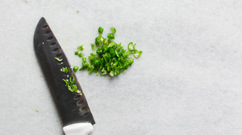Diced green chiles, with knife