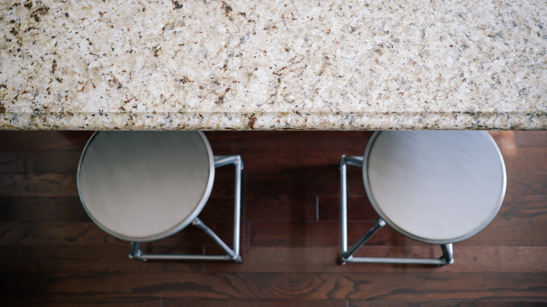 Overhead view of kitchen countertops and barstools