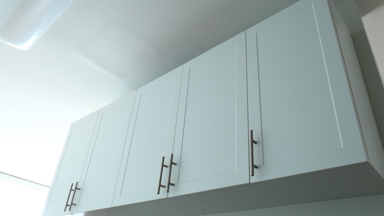 Underside view of white kitchen cabinets