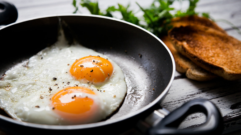 fried eggs in skillet