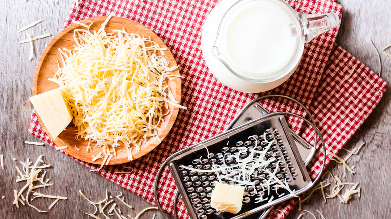 Milk and grated cheese for a cheese sauce