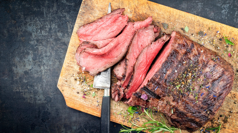 Sliced beef on cutting board