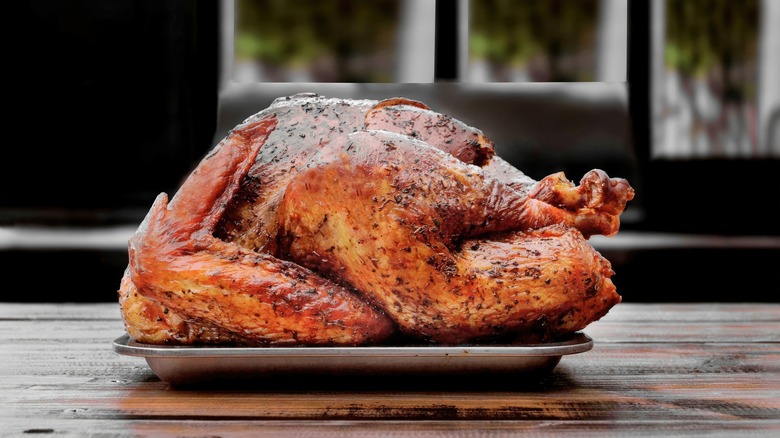 cooked turkey on baking sheet