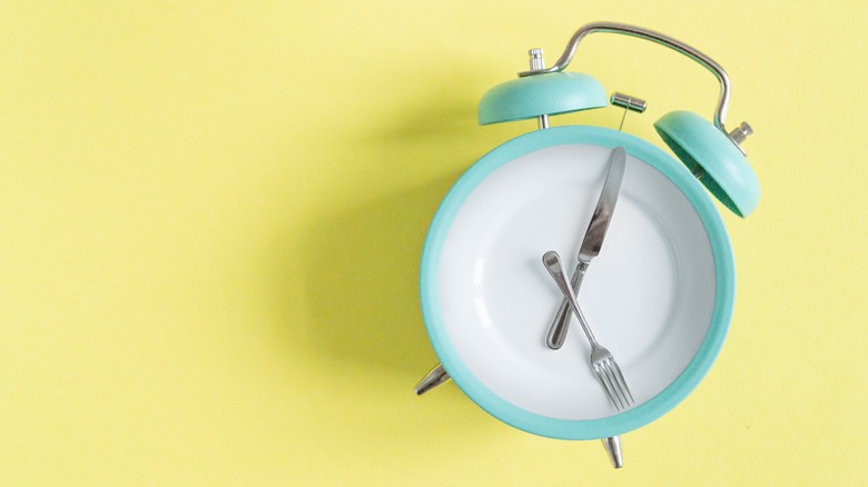 clock with cutlery for hands