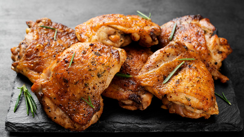 Chicken thighs on stone plate