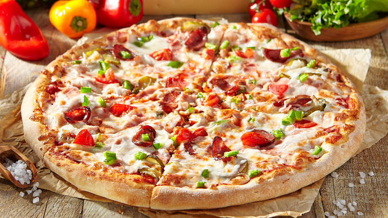 Pizza with salami on board