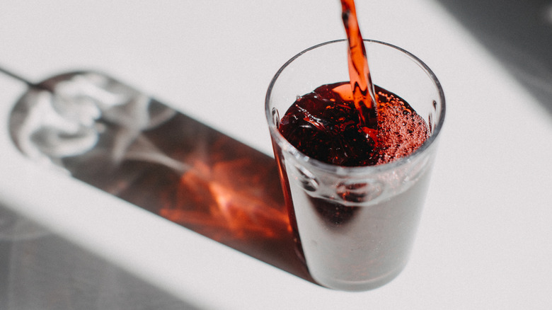 Cherry juice being poured into glass