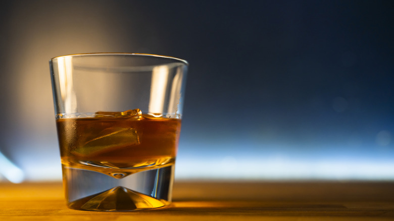 Glass of whiskey with ice