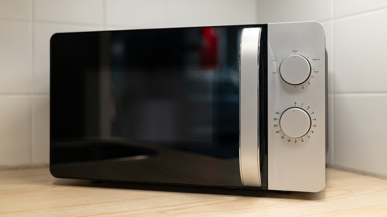 Black and white microwave on a counter