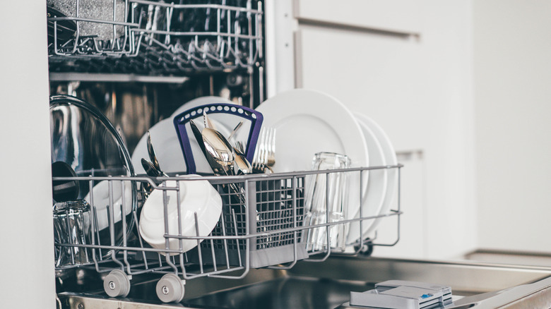 Open dishwasher with clean dishes