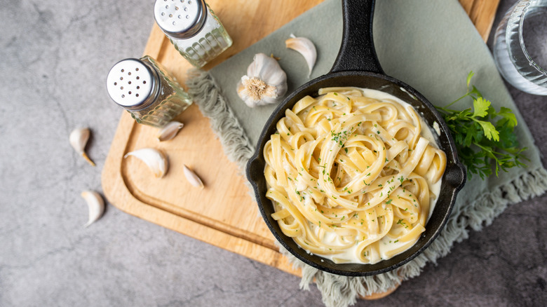 skillet of pasta alfredo sauce