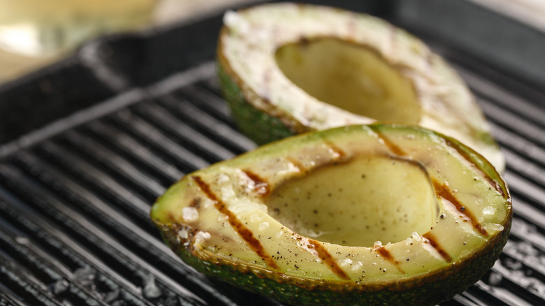 Grilling avocado halves