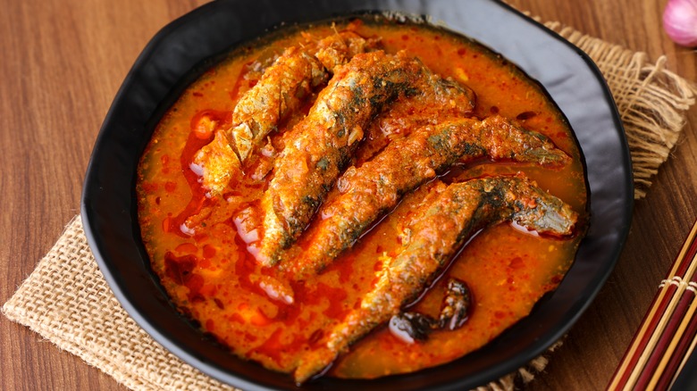 sardines in bowl of spicy red sauce