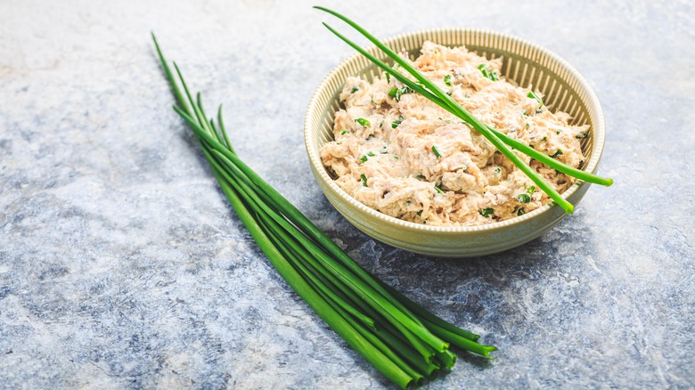 bowl of fish salad with chives