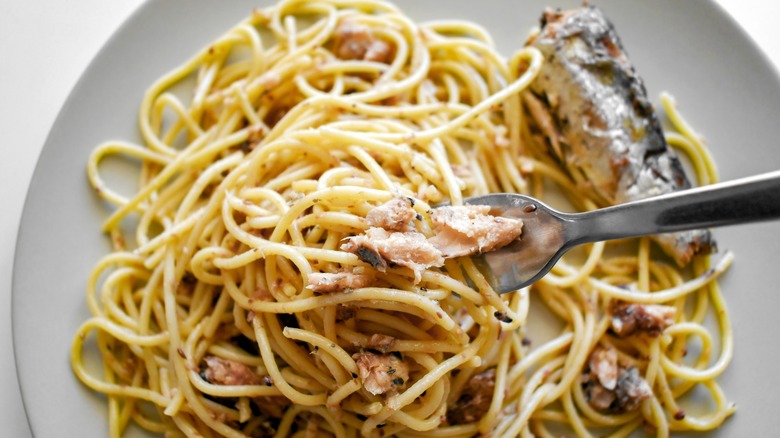 noodles with sardines on plate