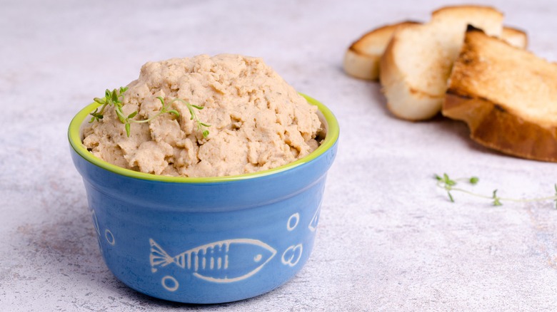bowl of fish spread with pieces of toast