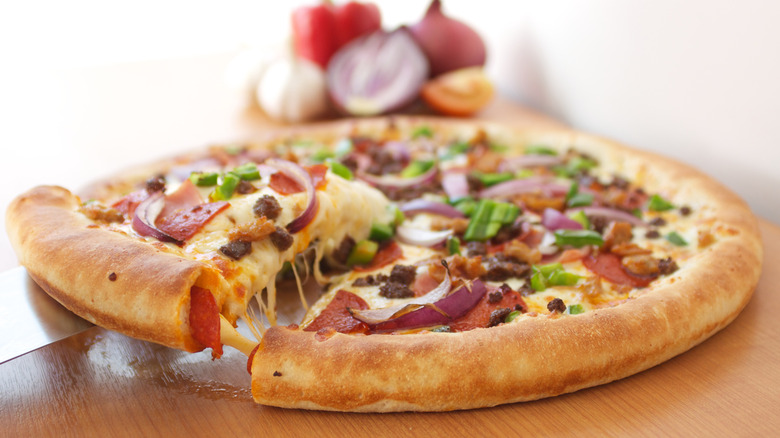 Stuffed crust pizza on a wooden board