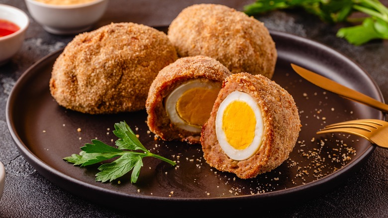 Scotch eggs on a plate