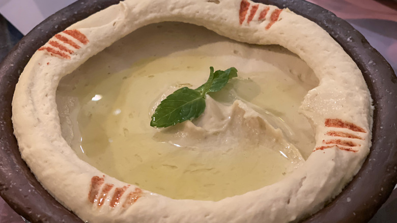 Hummus arranged in a serving dish