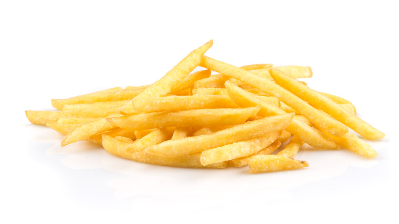 A pile of fries isolated on a white background
