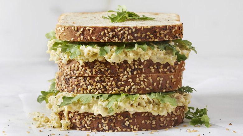 Tahini egg salad sandwich on sesame seed bread