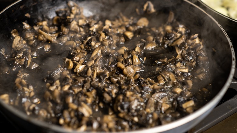 Mushroom duxelles cooking in a pan