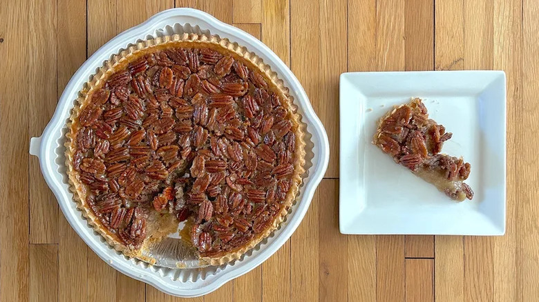 Slice and whole Kirkland Signature Pecan Pie from Costco