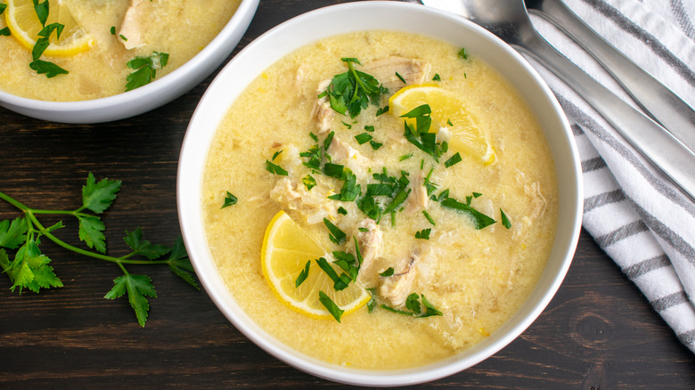 shredded chicken soup with lemon slices