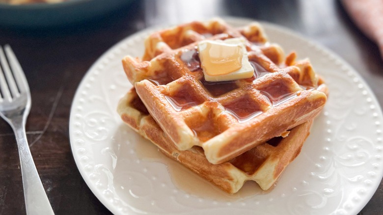 Waffles and butter on plate