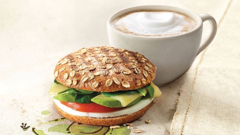 egg white bagel sandwich and a cappuccino