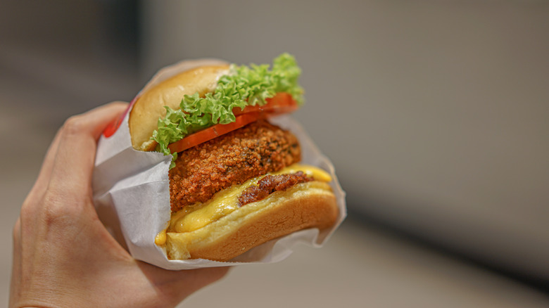 hand holding up shroom burger