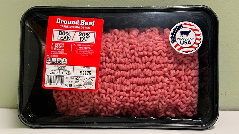 A package of 80/20 Ground Beef on a green and white background