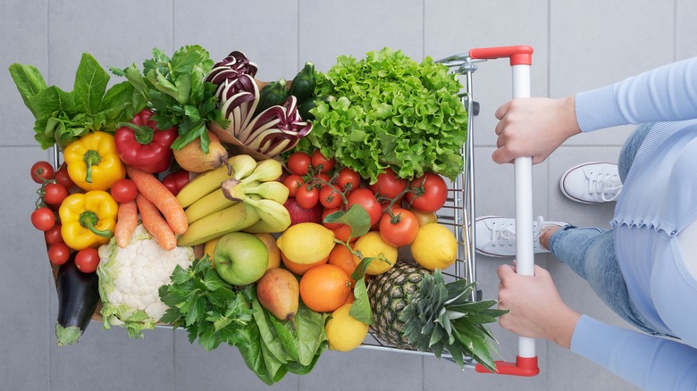 person pushing produce cart