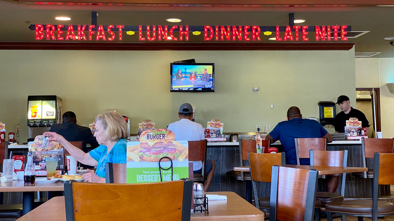 People eating in Denny's restaurant