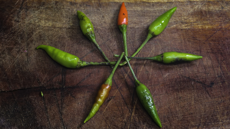 chili peppers on a board