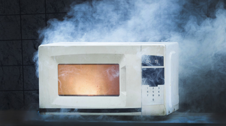 microwave smoking on counter top