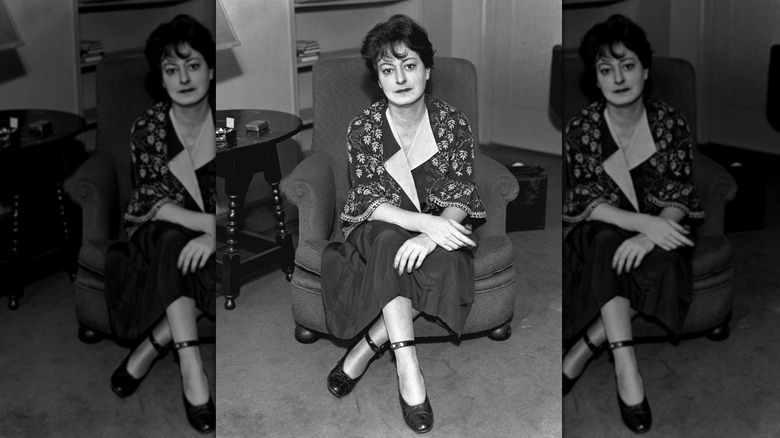Photo of Dorothy Parker seated in a chair