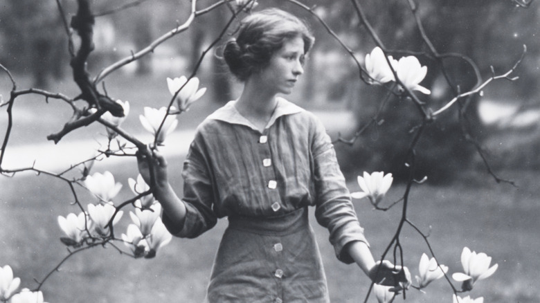 Photo of Edna St. Vincent Millay beneath magnolia branches