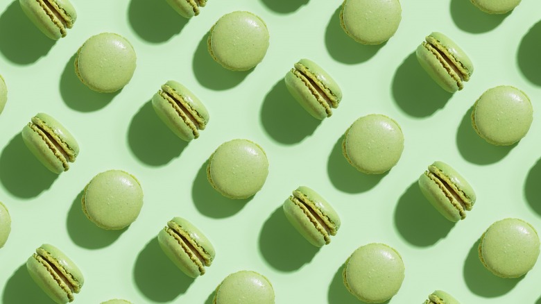 Green pistachio macarons in rows