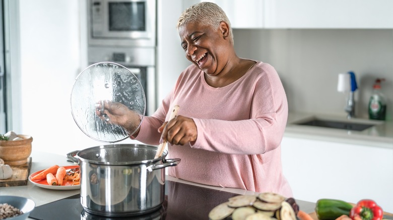 woman cooking at stove
